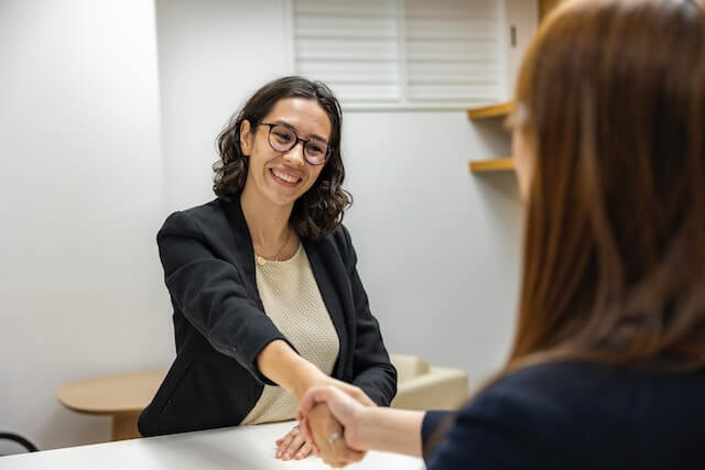 women shaking hands